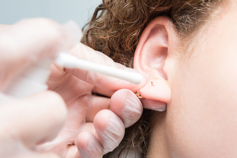 ear piercing treatment for decoration, close-up